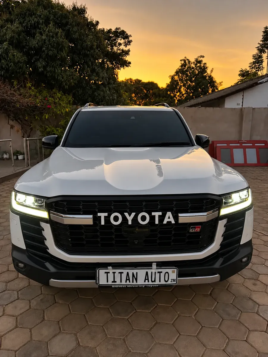 Toyota Land Cruiser 300 GR, front view at sunset, freshly tinted