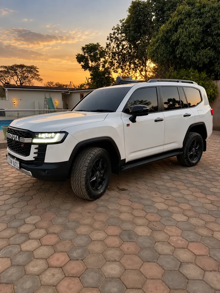 Toyota Land Cruiser 300 GR, front three-quarter view with tinted glass